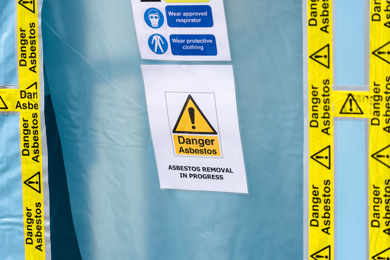 Asbestos warning on door for home